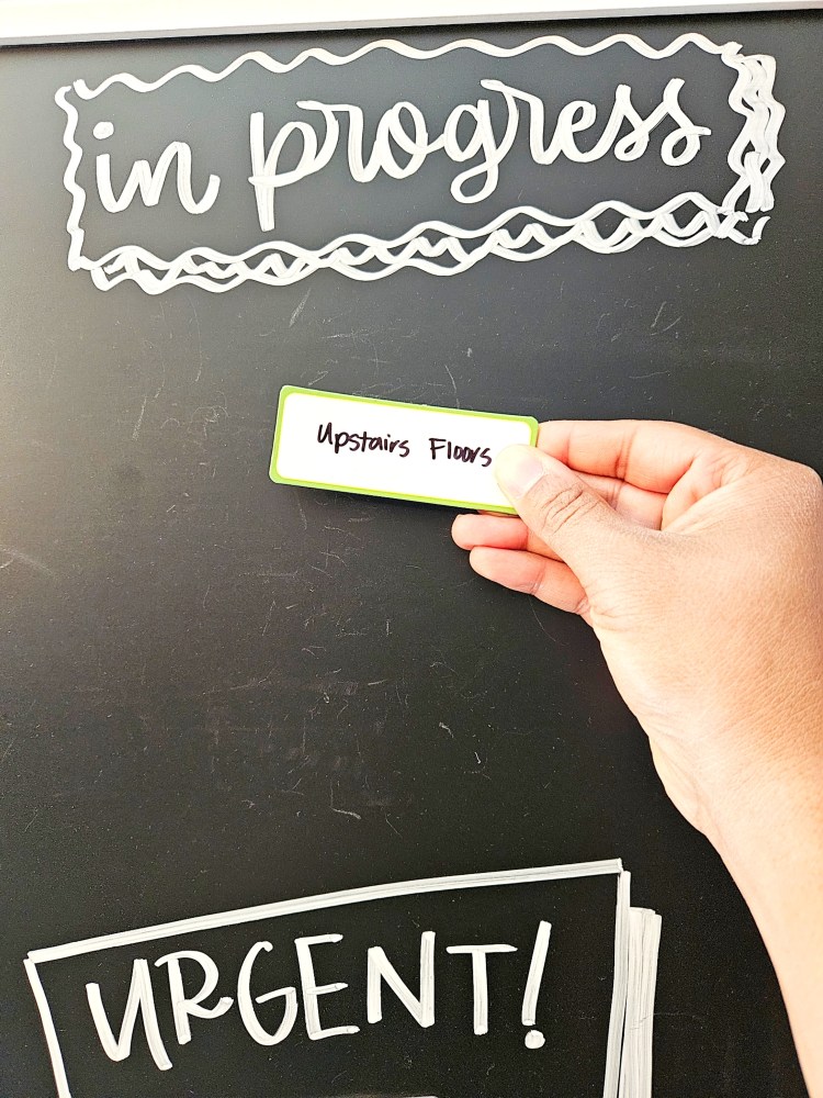 Moving items on my family household chores task board. 