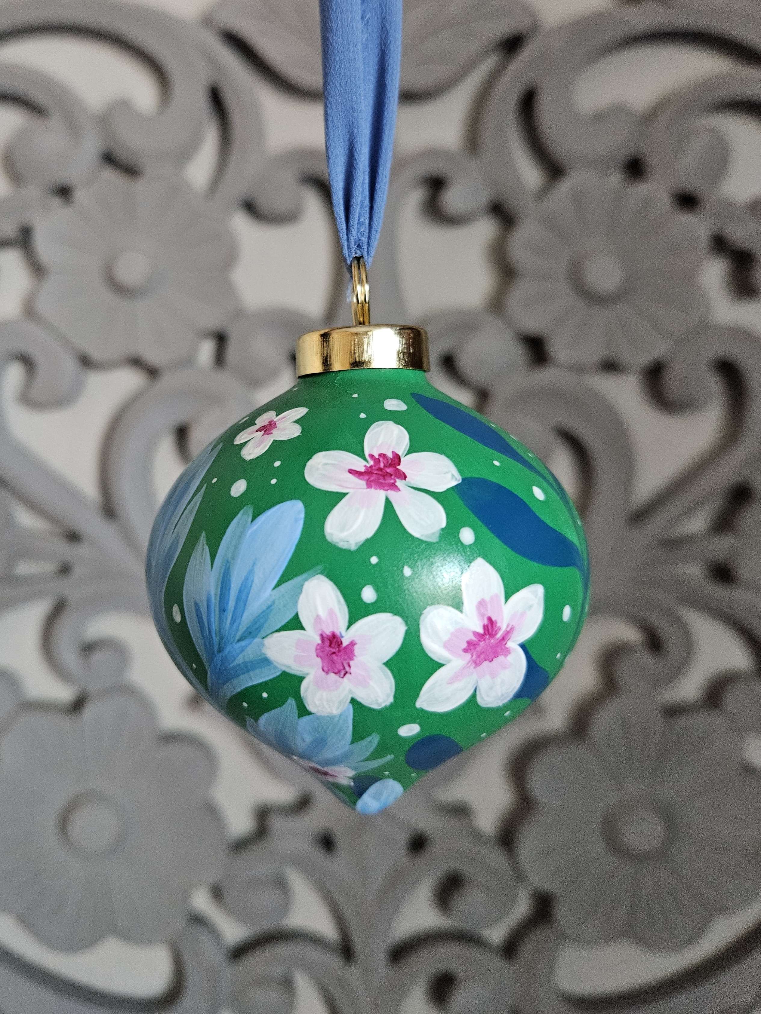 Green, pink, and blue Christmas ornament